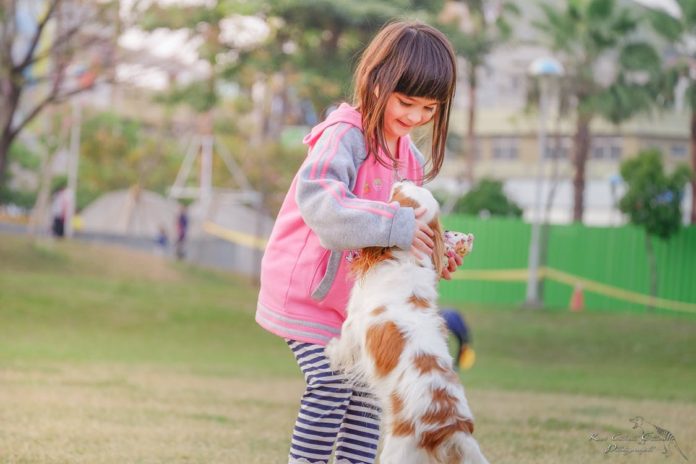 Girl with pet Dog